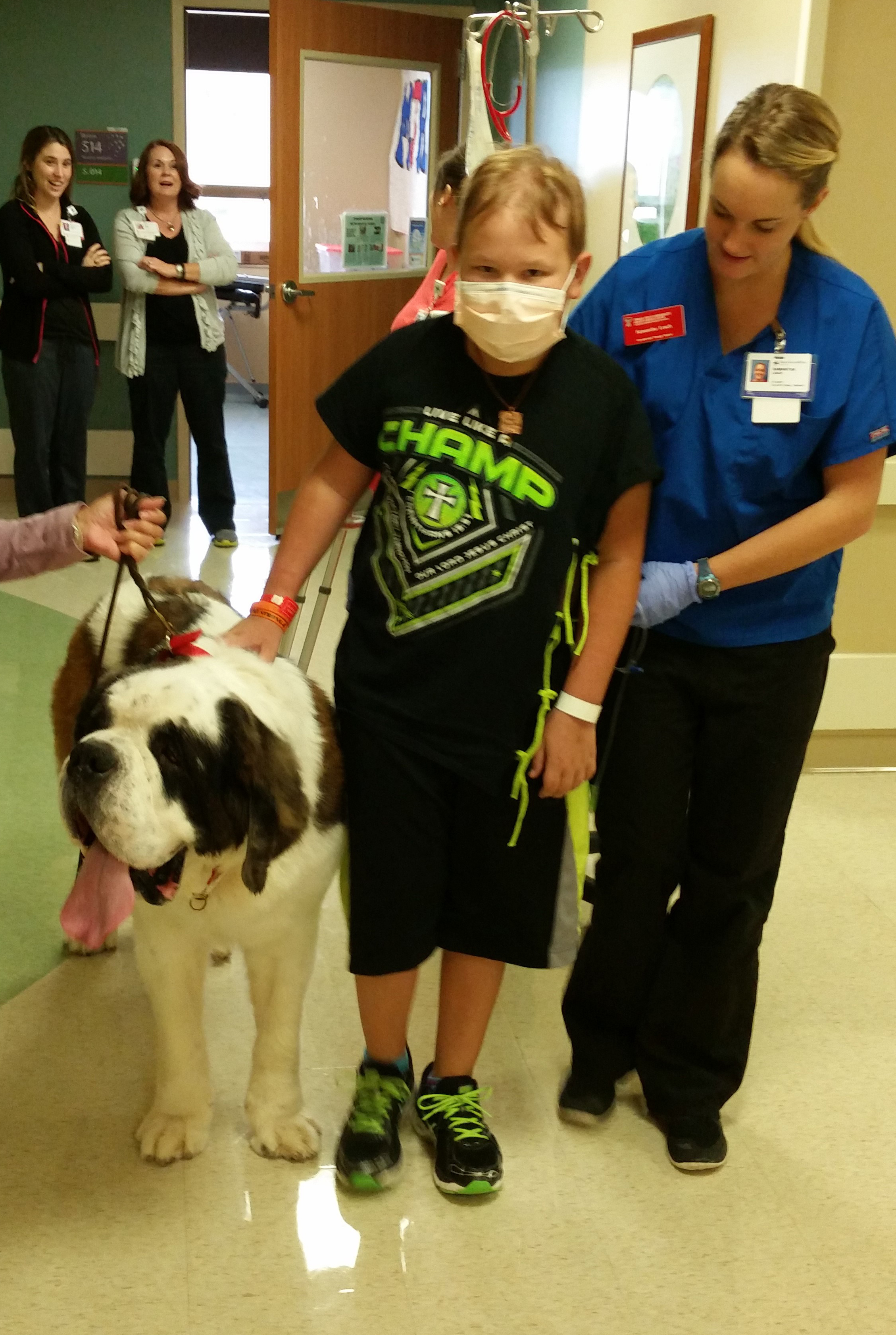 Luke Edmunds walks with a therapy dog