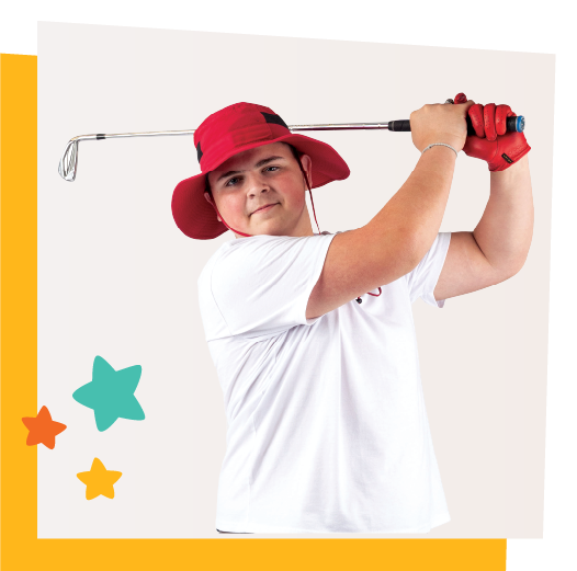 Teenage boy wearing a red hat and white t-shirt swings a golf club