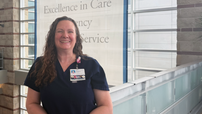 Nurse navigator at Baylor Scott & White Cancer Center – Round Rock standing inside the hospital, representing compassionate breast cancer care and patient support.