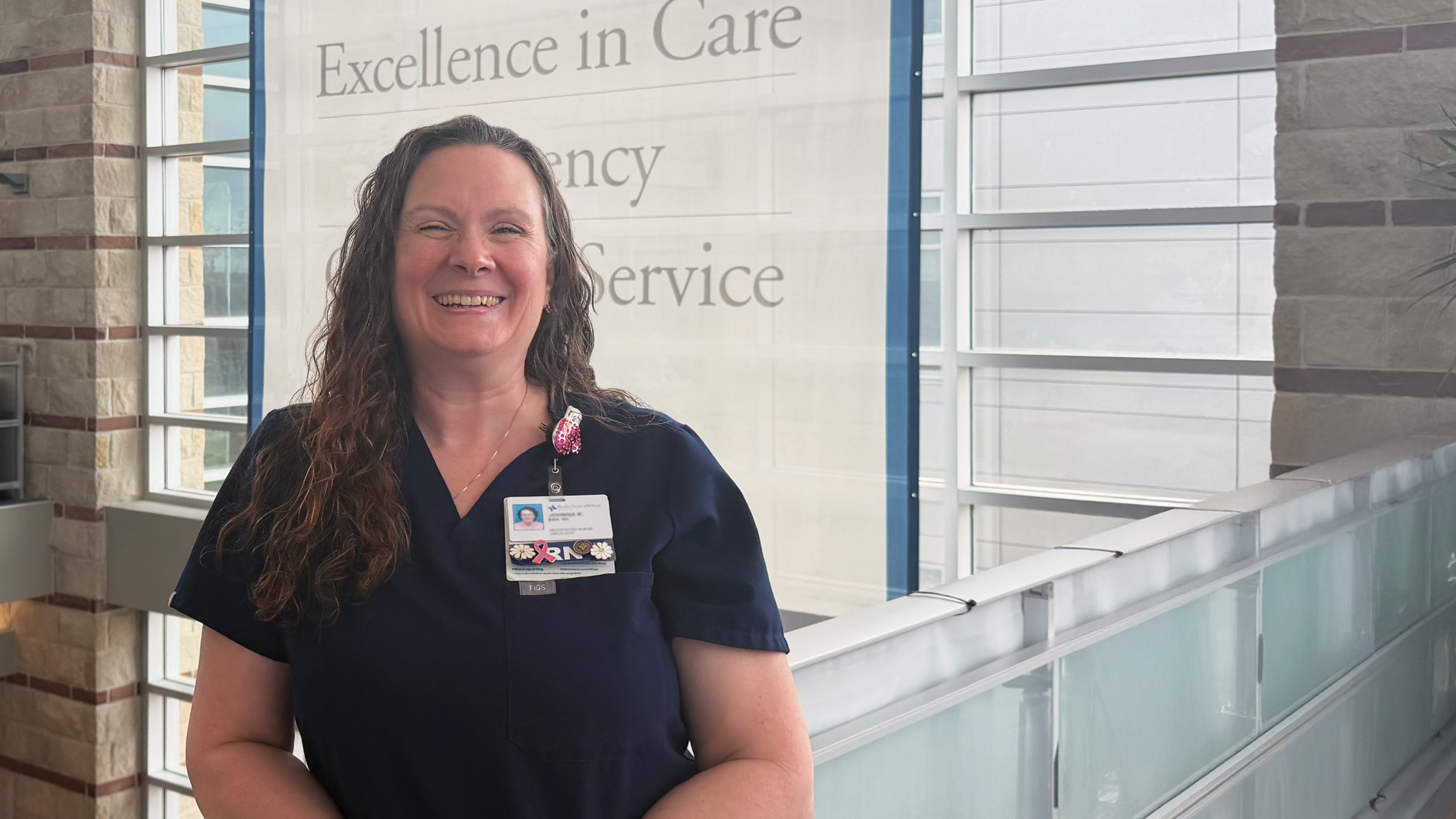 Nurse navigator at Baylor Scott & White Cancer Center – Round Rock standing inside the hospital, representing compassionate breast cancer care and patient support.